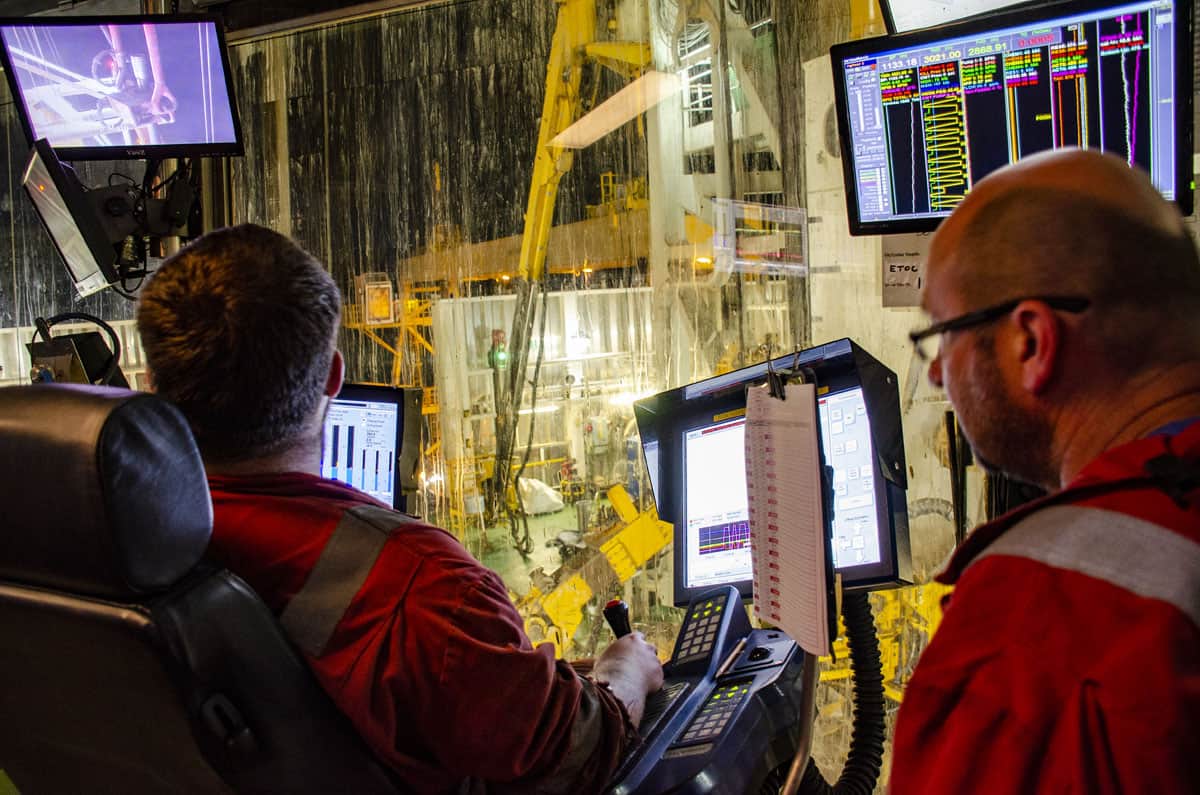 Ship crew staring at surveillance monitor