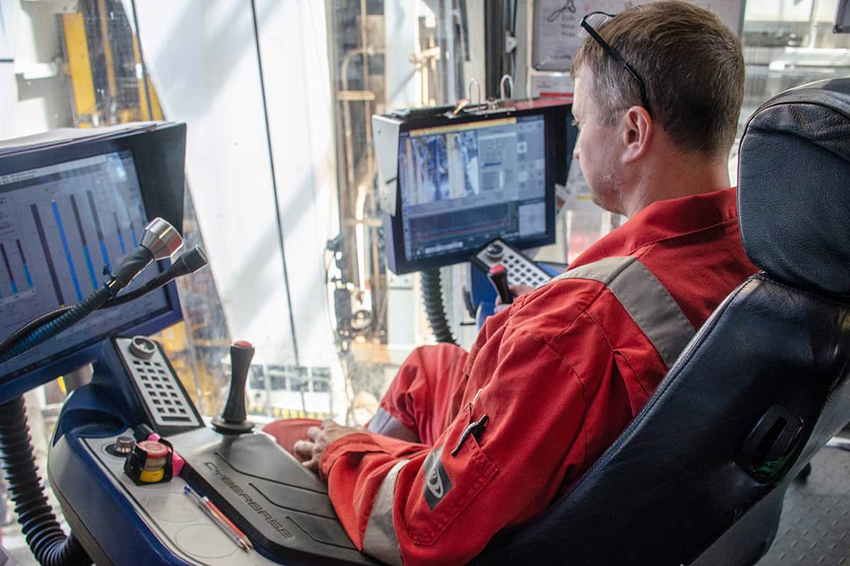 Drillship sitting down staring at computer monitors