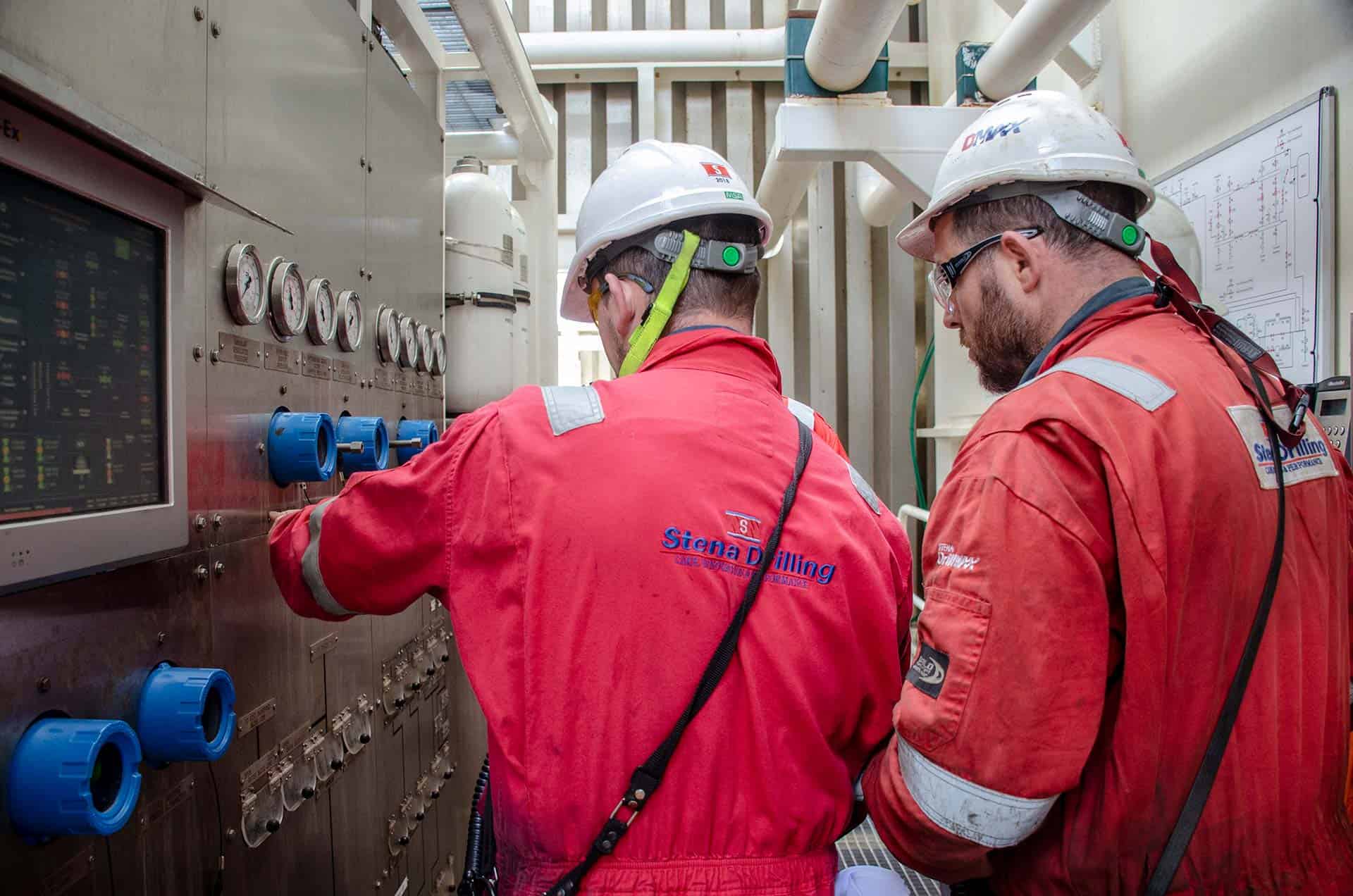 Drillship crew wearing red suits