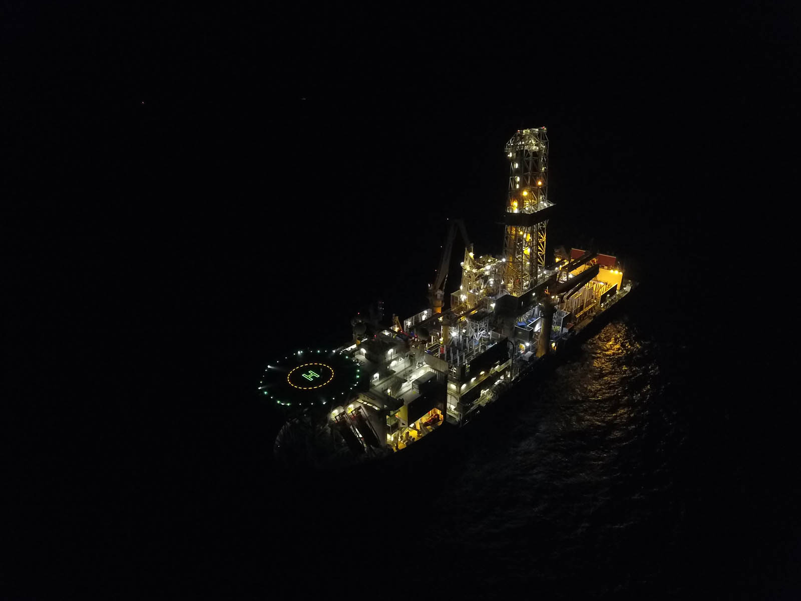 Drillship at night with lights