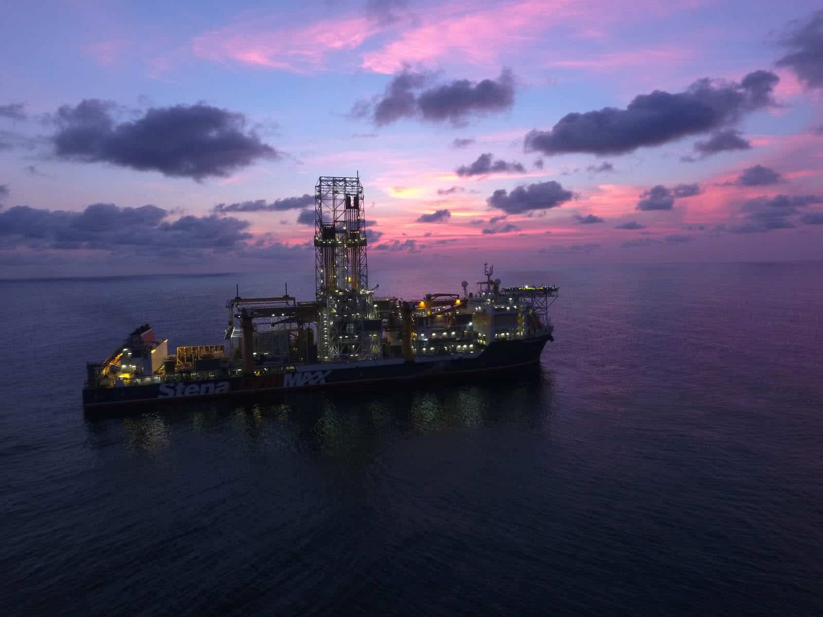 Drillship with pink and violet skies