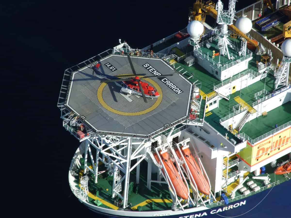 Stenna Carron drillship with helicopter in helipad and life boats