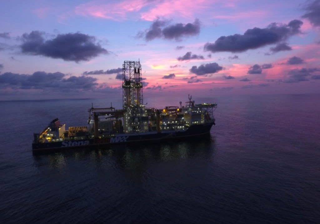 Drillship with pink and violet skies